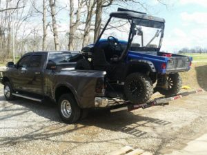 RAM 3500 loads UTV with MAD-RAMPS pivoting ramp system