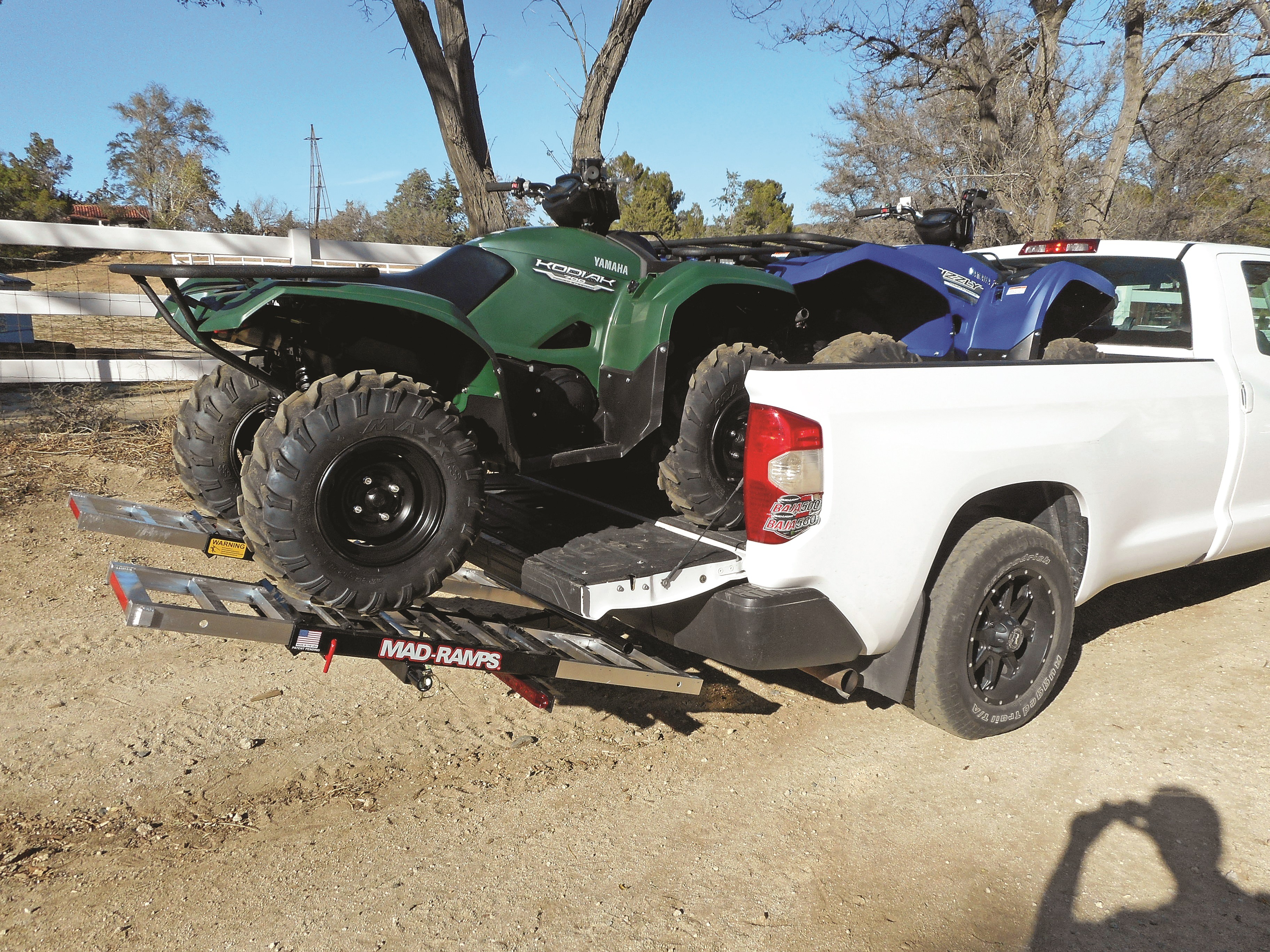 Chevy Silverado transports two ATVs with MAD-RAMPS