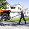 Woman locking pivoting ramps into place to transport ATV - MAD-RAMPS