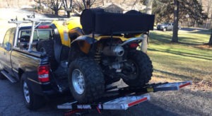 ATV loaded in truck bed with MAD-RAMPS