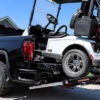 Golf Cart being loaded onto a truck bed with MadRamps