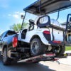 Golf Cart being loaded onto a truck bed with MadRamps