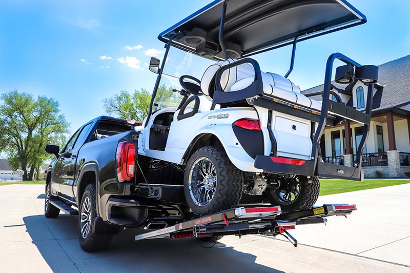 Golf Cart being loaded onto a truck bed with MadRamps