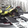 snowmobile loaded on truck with mad ramps