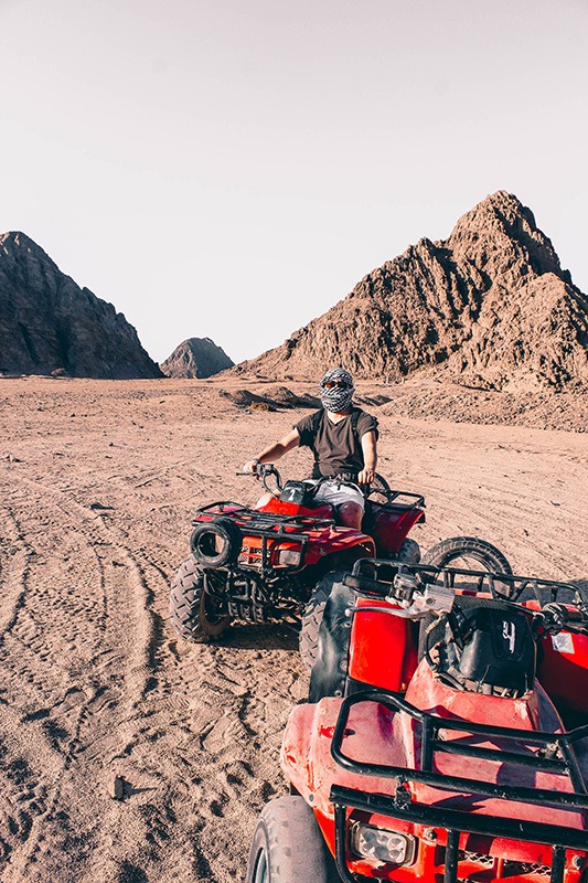 2 people in the desert riding atvs/itvs because of MadRamps