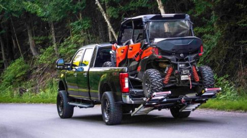 four passenger UTV loaded on a truck bed with MADRAMPS in drive position